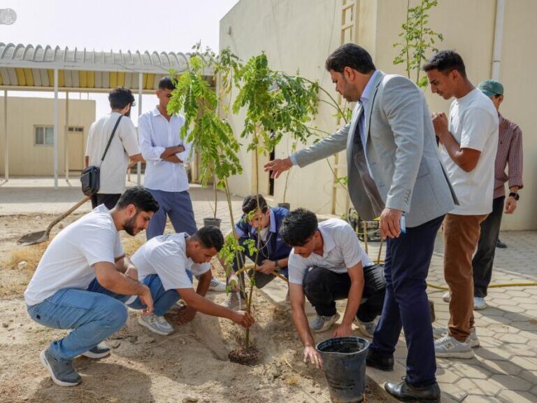 Fine arts students planting greenery at the Institute of Fine Arts in Najaf as part of the Holy Alawi Shrine’s “We Plant for the Love of Ali” campaign