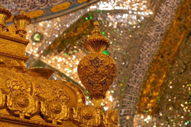 Close-up of the golden zarih and its gilded ornamentation at the sacred Alawi shrine of Amir al-Muminin in Najaf
